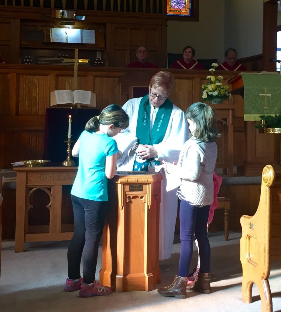 The children helping to  prepare for Sunday's baptism.